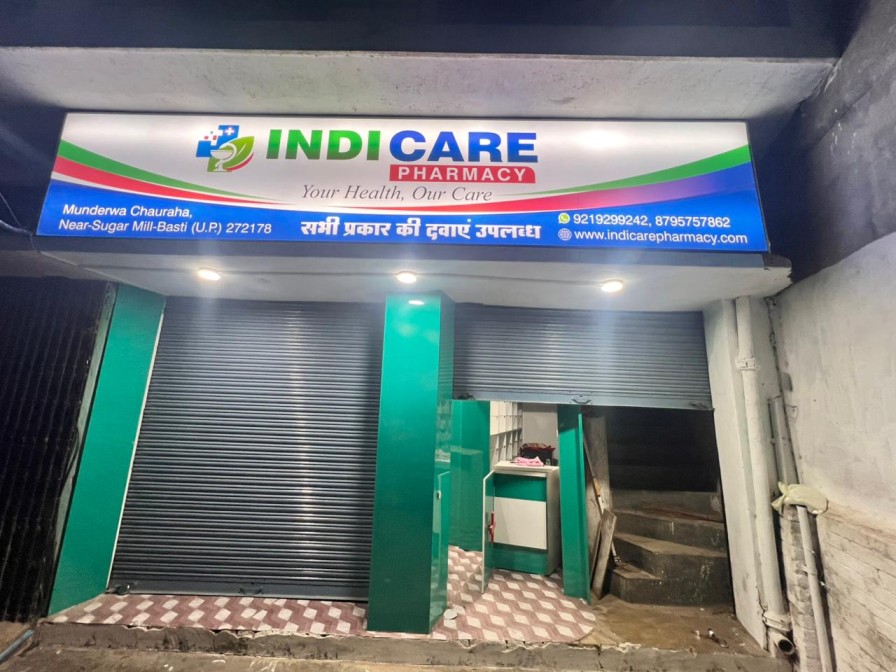 IndiCare Pharmacy storefront - night view